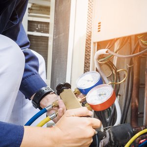 Technician is checking air conditioner